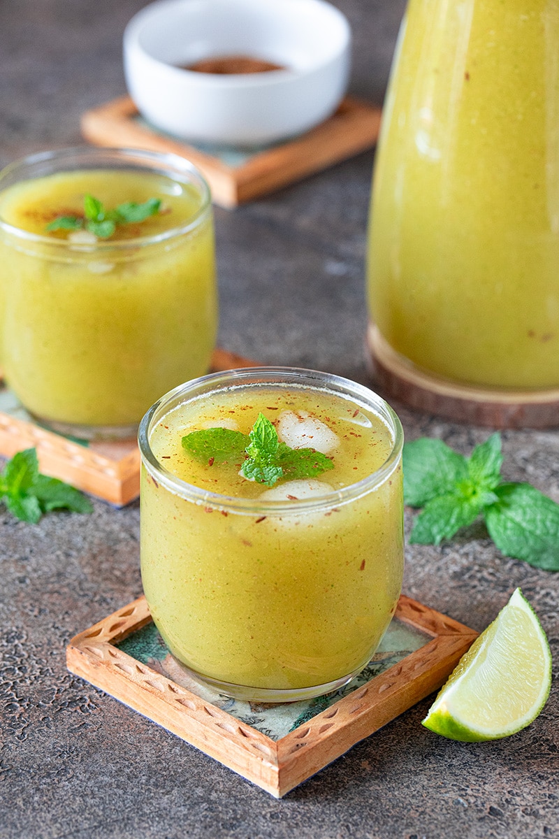 Aam ka Panna in a glass topped with mint leaves