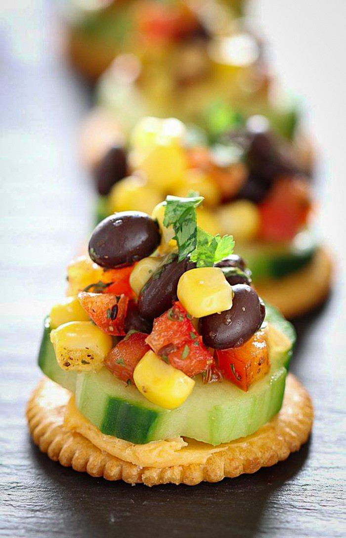 Ritz crackers topped with corn and black bean salsa