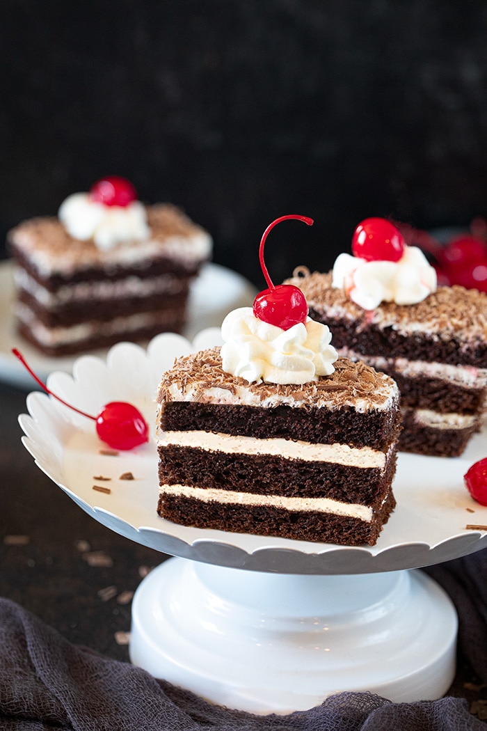 Chocolate Pastry on a laced tray topped with cherry