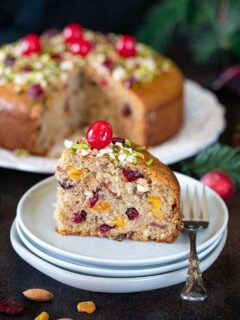 Slice piece of Spiced Fruit And Nut Cake on a plate