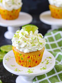 Eggless key lime cupcakes on a cake stand