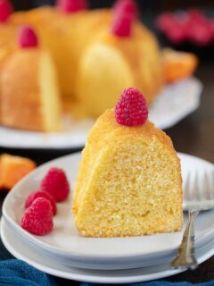 Cut slice of orange cake on a plate