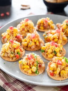 Corn Masala Chaat spread on papadis