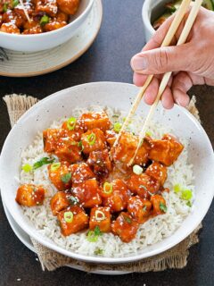 Stir-fried Sweet chili tofu garnished with scallions