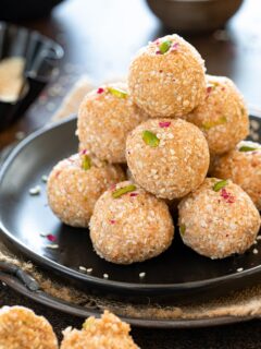 Stacked til ladoos on a plate