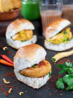 Vada pav topped with garlic chutney