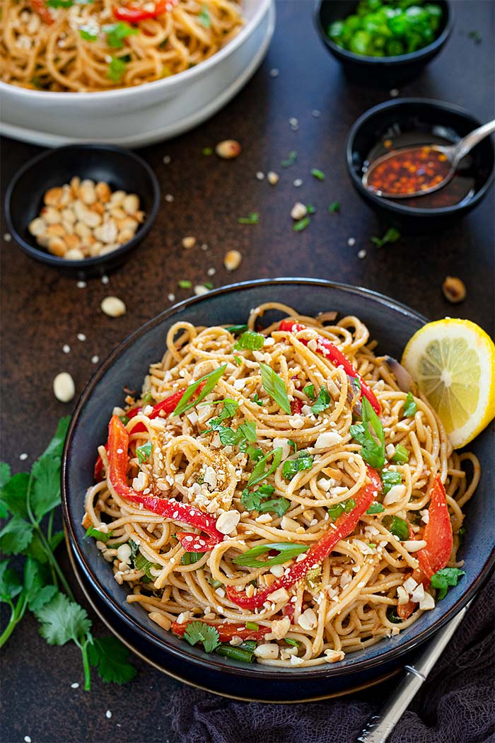 Vegan Spicy Peanut Noodles in a bowl with fork